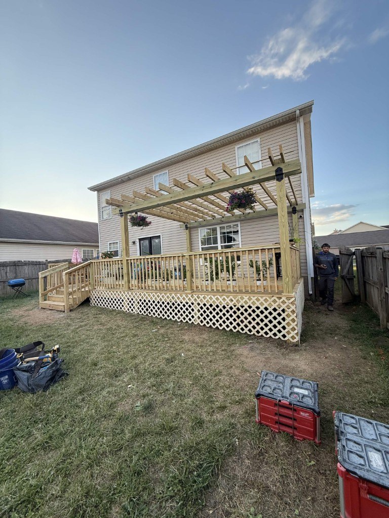 Completed backyard deck, pergola, and lattice skirting installation by Big Blue Fence & Deck in Lexington KY